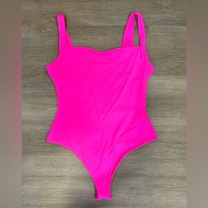 Skims “fits everybody square neck bodysuit” neon pink